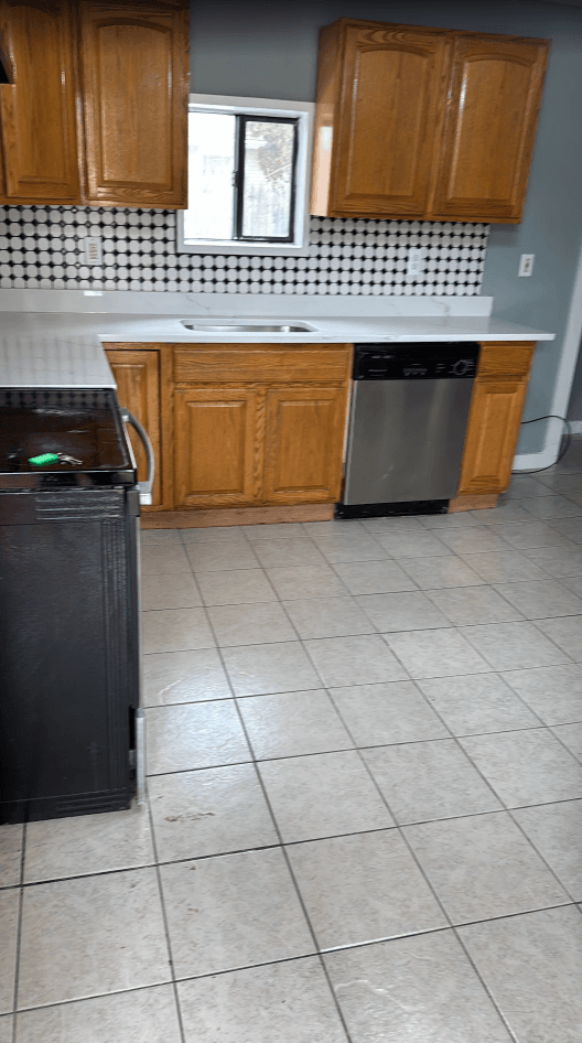 Wood cabinets with light flooring